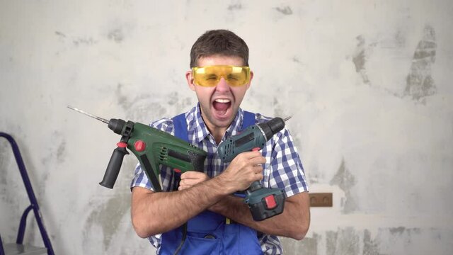 Emotional crazy male builder or worker with construction tools