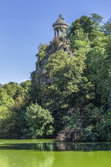The artificial lake in Parc des Buttes-Chaumont - Public Park situated in northeastern Paris. It opened in 1867; it is fifth-largest park in Paris. France.