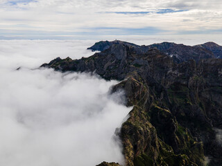 View of beautiful mountain landscape above the clouds of Madeira Island - Green mountain landscape with view above the sky
