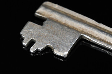 Old and worn door key