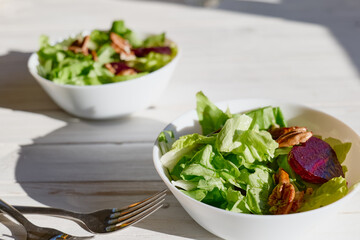 Vegan salad with lettuce, red beet and pecan nuts. Healthy Food. Diet. Healthy lifestyle concept. Cooking At Home