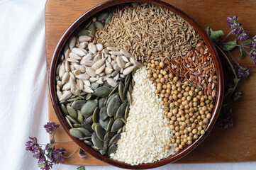 Spices and herbs in ceramic bowl. Seasoning, Colorful natural additives. Cuisine and healthy concept. flat lay