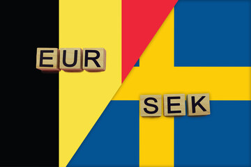 Belgium and Sweden currencies codes on national flags background