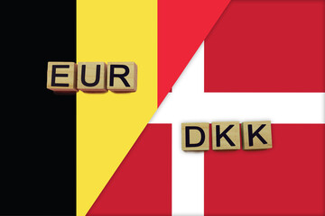 Belgium and Denmark currencies codes on national flags background