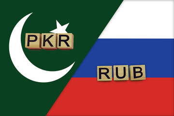 Pakistan and Russia currencies codes on national flags background