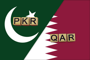 Pakistan and Qatar currencies codes on national flags background