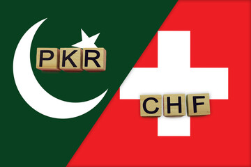 Pakistan and Switzerland currencies codes on national flags background