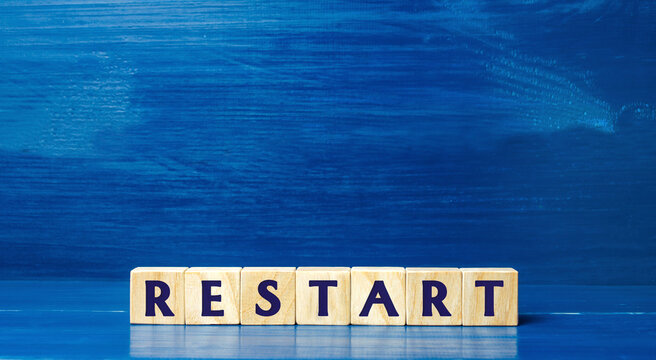 Wooden blocks with the word Restart. New beginning and launch. Start of a new process. Back to the roots. Business concept. Start again. Renewal