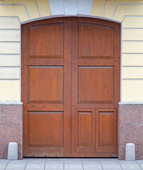 Old beautiful wooden door on the street.