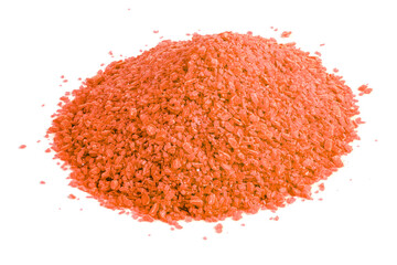 pile of dry orange chemical granules - close-up isolated on white background