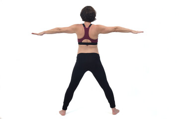 rear veiw of a portrait of a pregnant woman exercising on white background