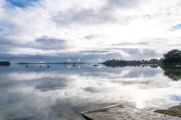 Brittany, panorama of the Morbihan gulf, view from the Ile aux Moines island at sunrise

