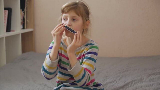Girl playing the harmonica home interior