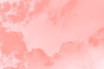 Fototapeta na wymiar Pink coral soft color sky background with clouds
