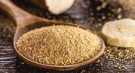 wooden spoon with alternative flour, vegan food, typical of Brazil, made with cassava. Typical South American root