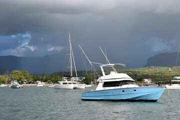 Mauritius dated 5th of Feb 2021. Leisure boats moored in a tranquil bay with in the background a...