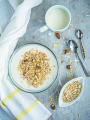 Muesli with milk and nuts. View from above. Healthy diet. Delicious and healthy breakfast.