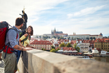 Happy tourist couple sightseeing; Traveller lifestyle