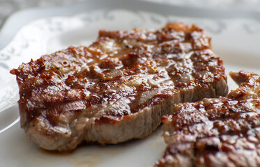 The Grilled pork steaks on a plate