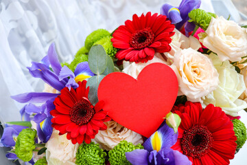 Happy Valentine's Day greeting card. beautiful bouquet of flowers and red heart 