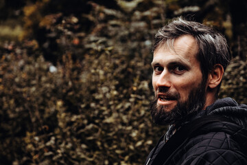 Artistic photo portrait confident smiling handsome middle-aged Caucasian man portraited in the...