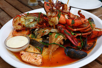 Grilled seafood platter on wooden table