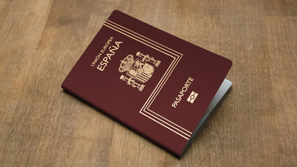 Spanish dark red passport on a woody background
