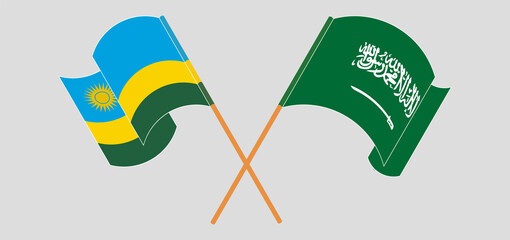 Crossed and waving flags of the Kingdom of Saudi Arabia and Rwanda
