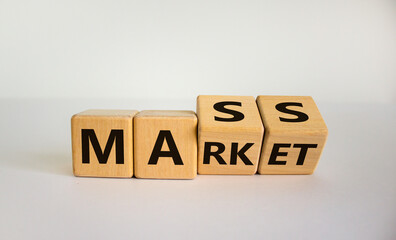 Mass market symbol. Turned wooden cubes with words 'mass market'. Beautiful white background, copy space. Business and mass market concept.