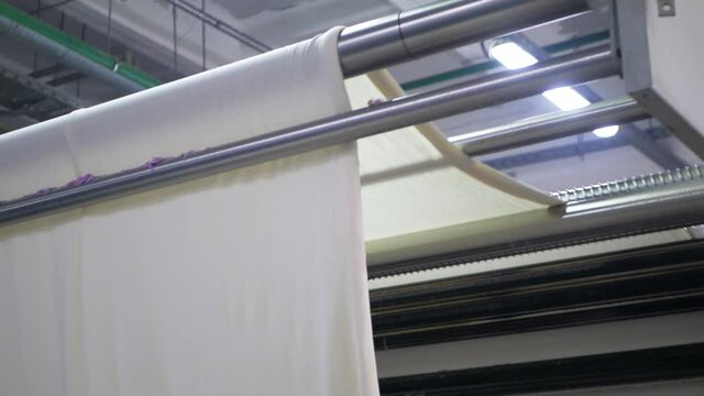 Fabrication and dyeing of fabric at the factory. Textile factory industry.