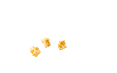 Several pieces of cheese cut into cubes on a white background