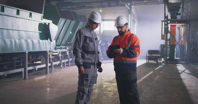 Engineer and supervisor during inspection in workshop