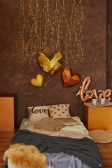 Romantic interior in brown colors with bed