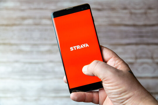 02-05-2021 Portsmouth, Hampshire, UK A Mobile phone or cell phone being held showing the Strava app open on screen