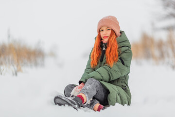 Red-haired teen girl in wintertime - 411027649