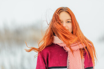 Red-haired girl in wintertime - 411027687