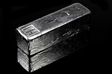 99.995% fine indium ingot isolated on black background