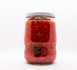 Glass jar of homemade preserved peeled tomatoes - 