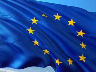 The European Union flag waving in the blue sky