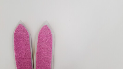 bunny ears and Easter eggs on a light background. the great feast of Easter