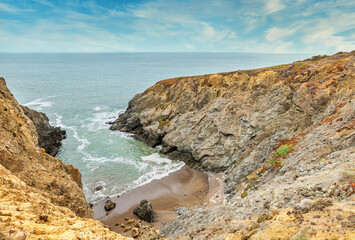 A beautiful view of a small cove in the Pacific Ocean, California, colorful landscape, bright sunny weather.