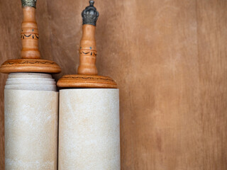 Fragment of Parchment Torah Scrolls on a wooden brown table..copy space.