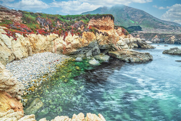 A beautiful view of a small cove in the Pacific Ocean, California, colorful landscape, bright sunny...