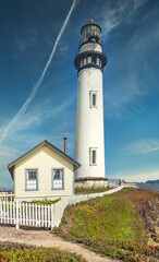 Pigeon Point lighthouse against the backdrop of a beautiful sky and ocean with waves, a great landscape of the Pacific coast in California