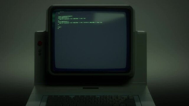 Retro personal computer or PC with source code displayed on monitor. Digital noise, distortions, glitch effects and artifacts. Vintage display or screen. Dark green colors. 80s, 90s style 4K animation