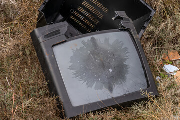 Television set polluting and littering the countryside with residues