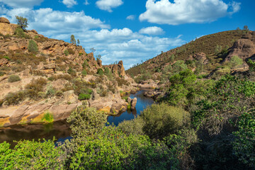 Rock formations in Pinnacles National Park in California, the destroyed remains of an extinct volcano on the San Andreas Fault. Beautiful landscapes, cozy hiking trails for tourists and travelers.