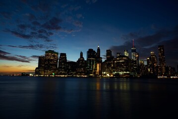 Fototapeta na wymiar Illuminated City At Waterfront