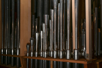 Inside a church organ, register with reed pipes from metal with tuning wire and resonator, musical instrument