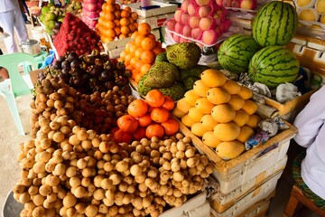 seasonal fruits, mango, watermelon, orange, apel, rambutan, mangustean on the marked